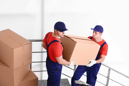 Person sorting cardboard and packaging for recycling at Aldgate Storage