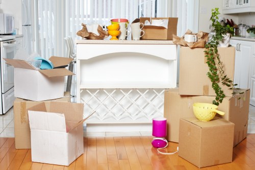 Packed moving boxes ready for a man and van collection in Aldgate