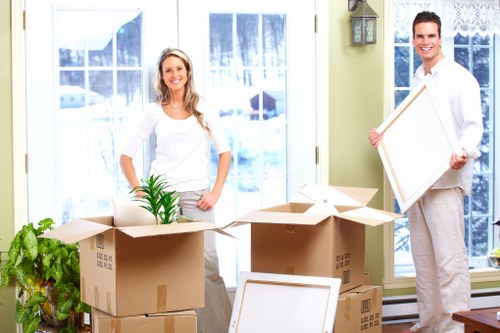 Packed storage boxes and furniture in an Aldgate unit