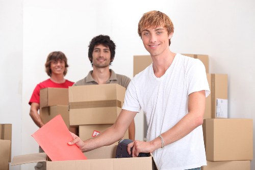 Local removal team handling furniture in Aldgate